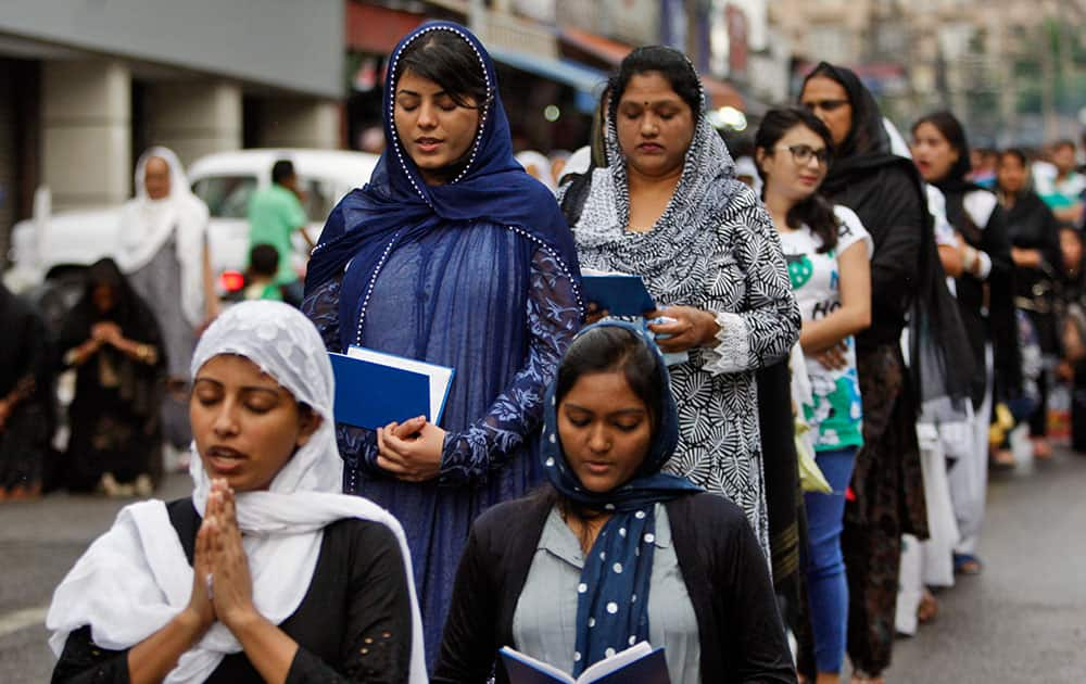 Christian devotees pray on Good Friday in Jammu.