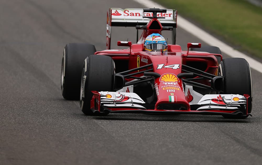 Ferrari driver Fernando Alonso of Spain drives during the practice session for Sunday`s Chinese Formula One Grand Prix at Shanghai International Circuit in Shanghai.