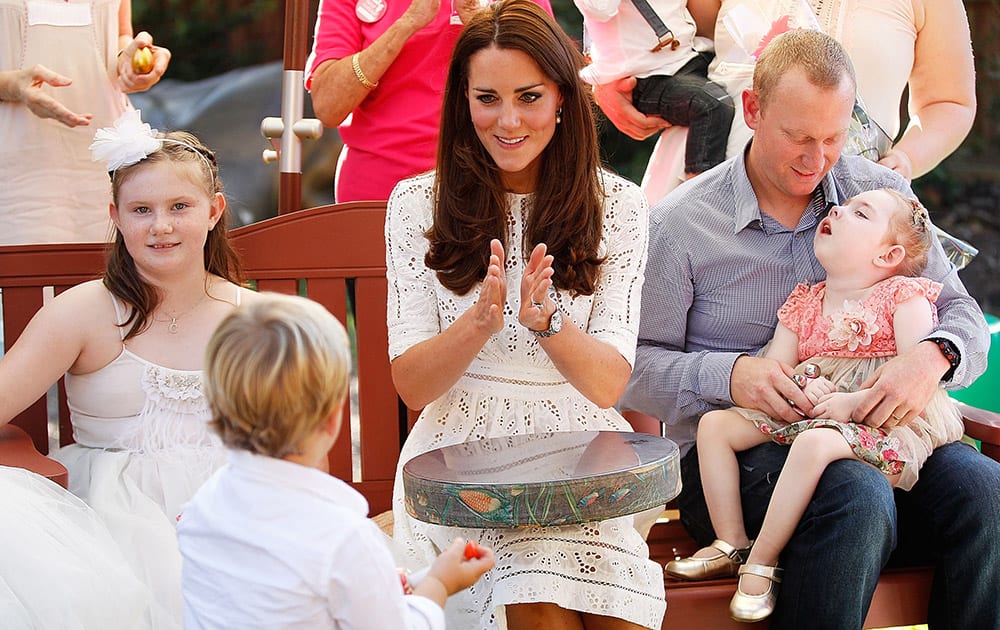 Britain`s Kate, the Duchess of Cambridge sings with patients of Bear Cottage, a children`s hospice, in Sydney, Australia.