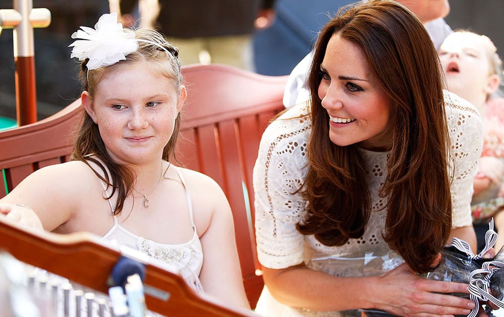 Britain`s, Kate, the Duchess of Cambridge speaks with a patient of Bear Cottage, a children`s hospice, in Sydney, Australia.