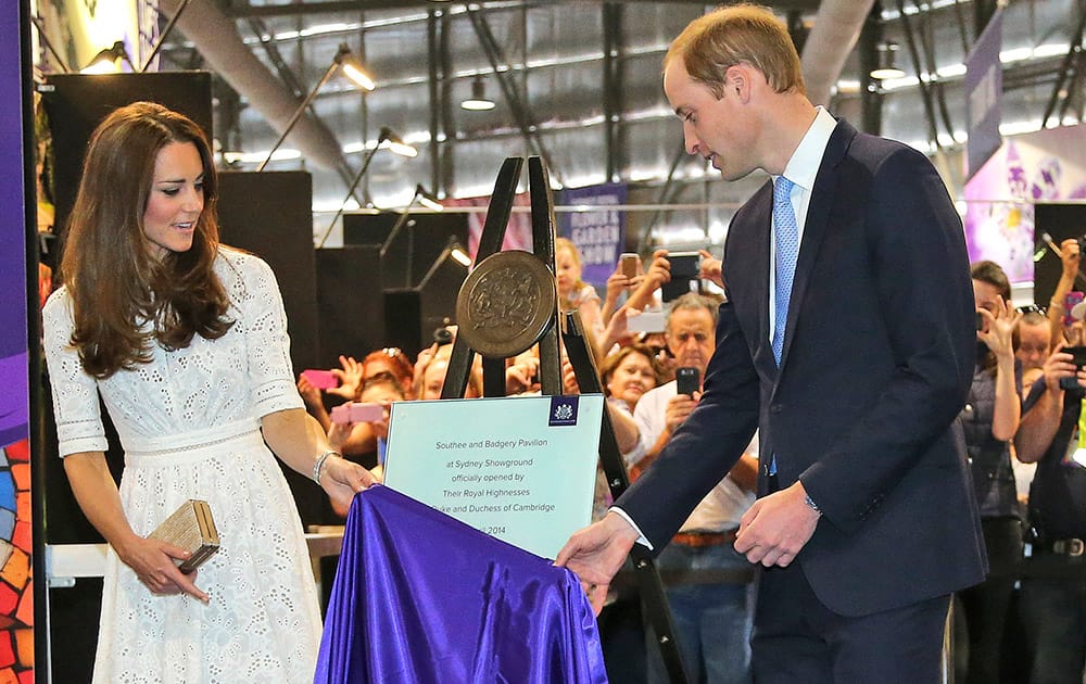 Britain`s Prince William, Kate, Duchess of Cambridge, unveil a plaque to mark the official opening of a new arts and craft pavilion during a visit to the Royal Easter Show in Sydney, Australia.