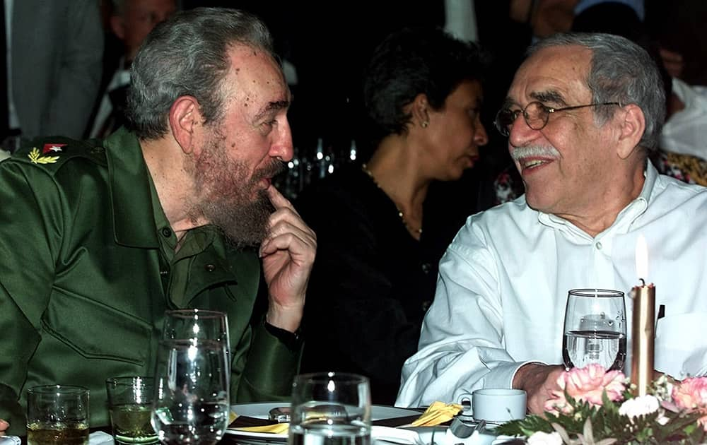 FILE - In this March 3, 2000 file photo, Cuba`s leader Fidel Castro, left, and Colombian Nobel laureate Gabriel Garcia Marquez speak during a dinner at the annual cigar festival in Havana, Cuba.