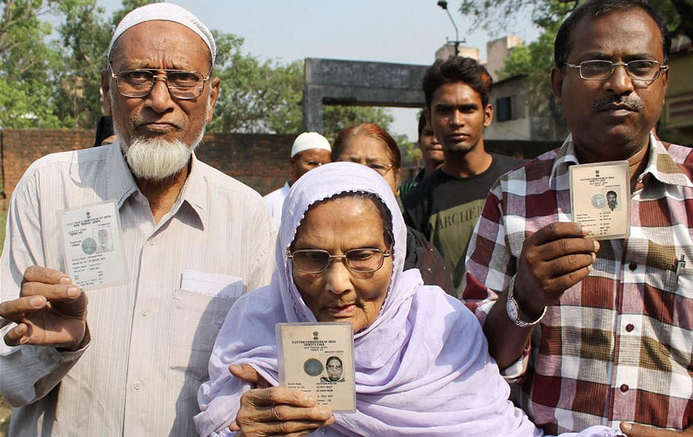 Members of a Muslim family arrive to cast their votes for Lok Sabha elections in Jamshedpur.