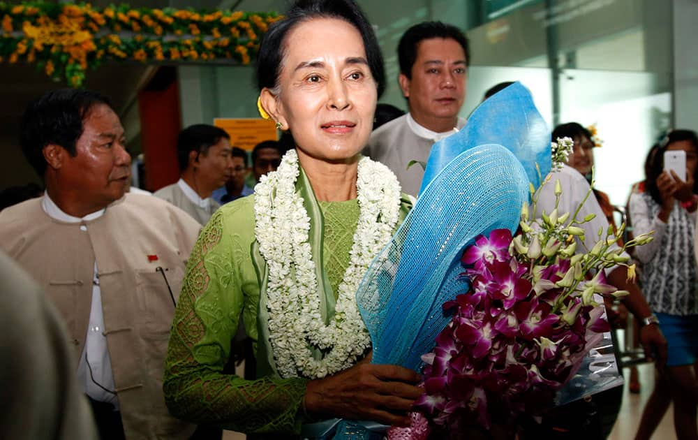 Myanmar opposition leader Aung San Suu Kyi arrives at Yangon International Airport after returning from Europe where she visited France followed by Germany in Yangon, Myanmar. 