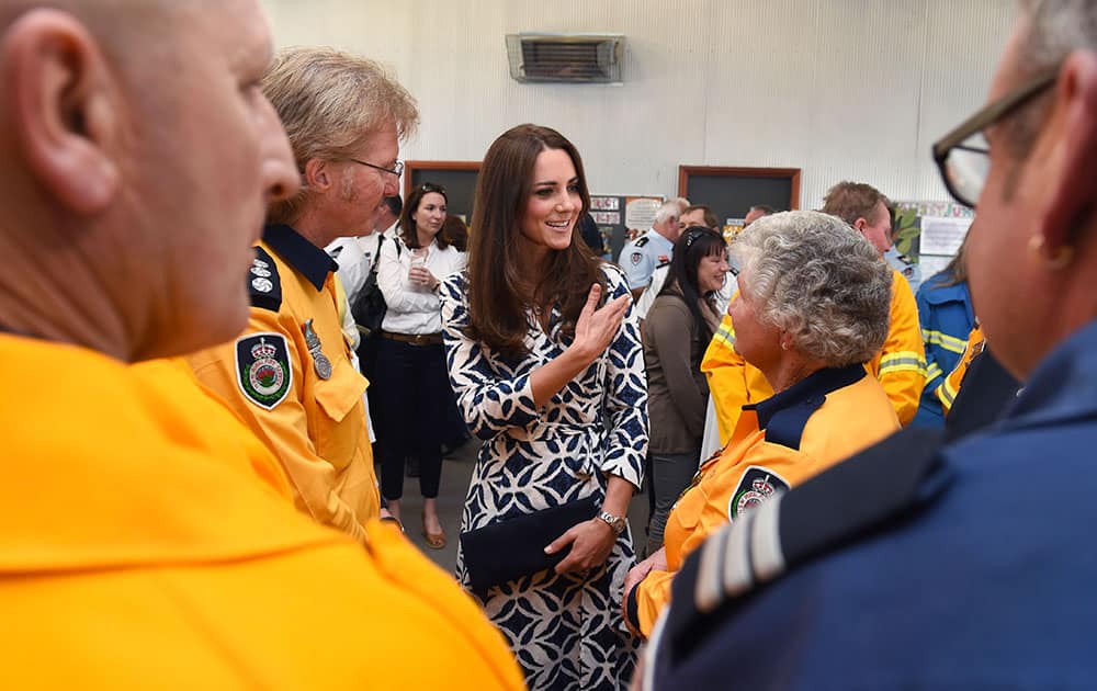 Britain`s Kate, the Duchess of Cambridge meets with emergency services personnel at Winmalee, an area in the Blue Mountains heavily affected by bushfires.