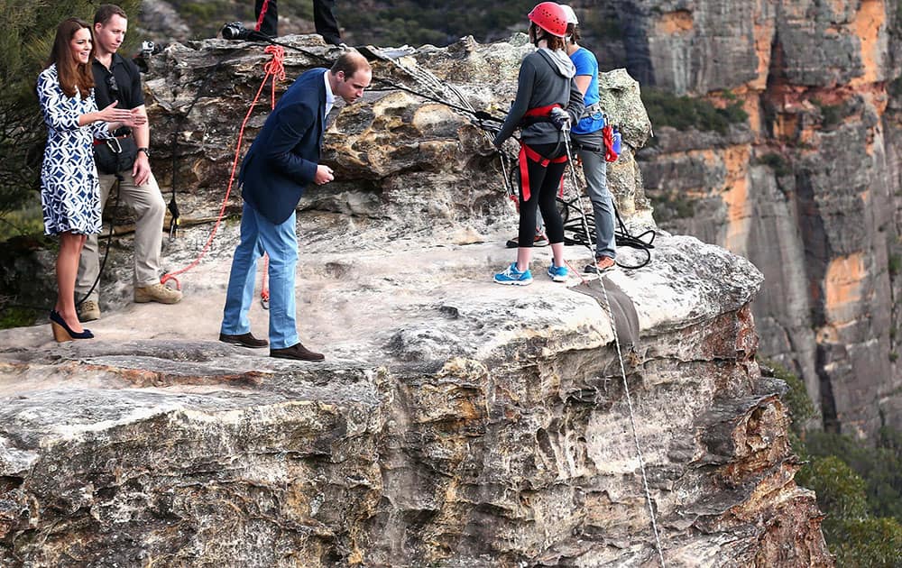 Britain`s Prince William looks over the cliff edge as he and his wife Kate, the Duchess of Cambridge observe abseiling and team building exercises at Narrow Neck Lookout near Katoomba, Australia.