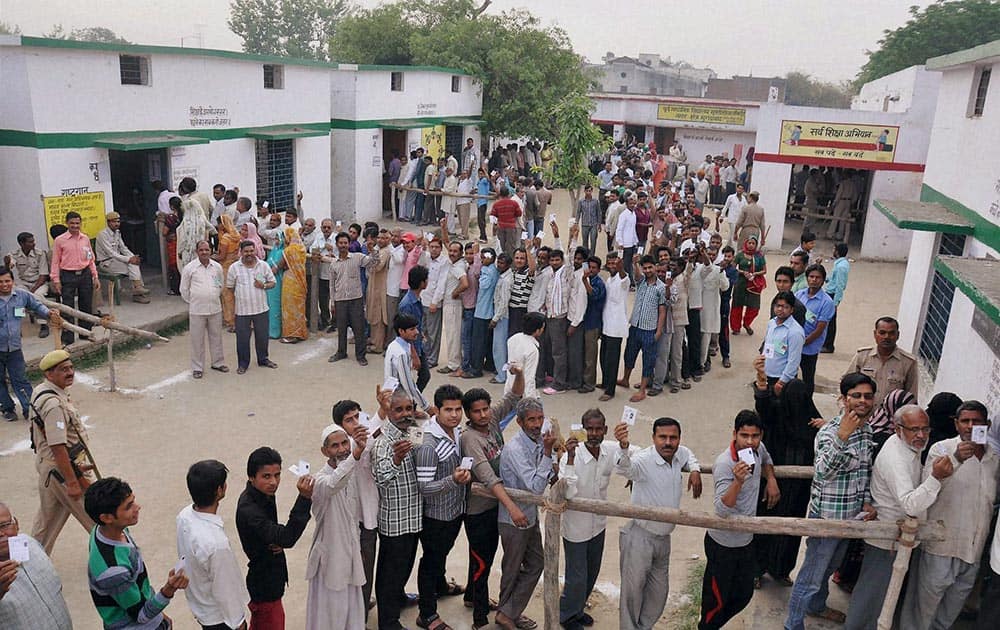 Voters stand in queue to cast their vote for Lok Sabha elections in Moradabad, Uttar Pradesh.