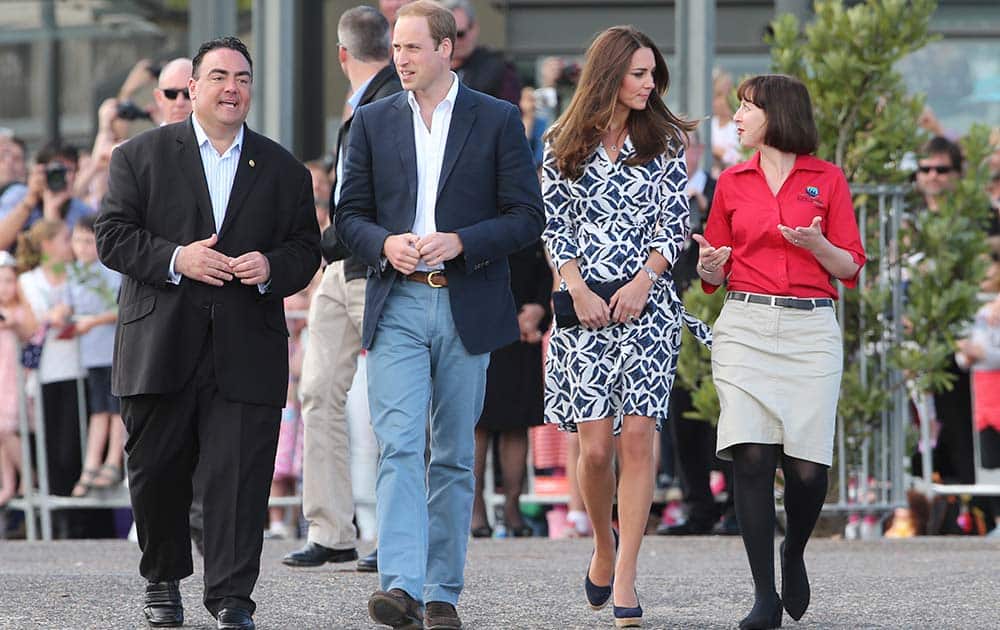 Britain`s Prince William, center left, and his wife Kate, the Duchess of Cambridge , center right, walk with Randall Walker, left, chief executive officer of Blue Mountains Lithgow and Oberon Tourism and Anthea Hammon, joint managing director of Scenic World the Echo Point Lookout at in Katoomba, Australia.