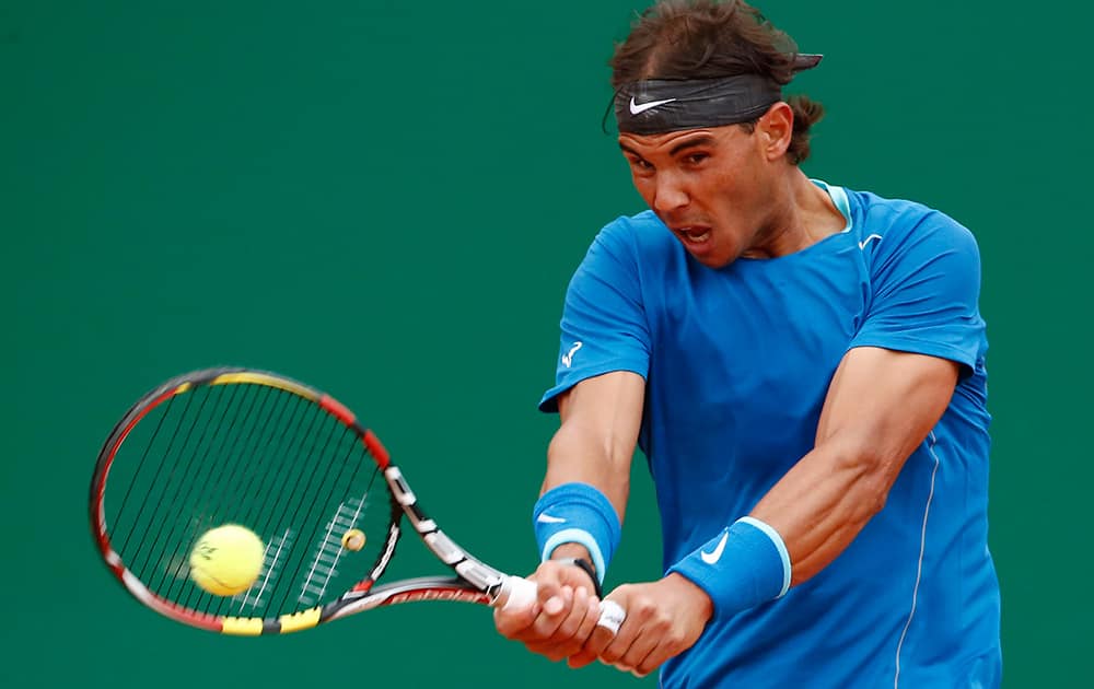 Rafael Nadal of Spain, returns the ball to Teymuraz Gabashvili of Russia during their match of the Monte Carlo Tennis Masters tournament in Monaco.