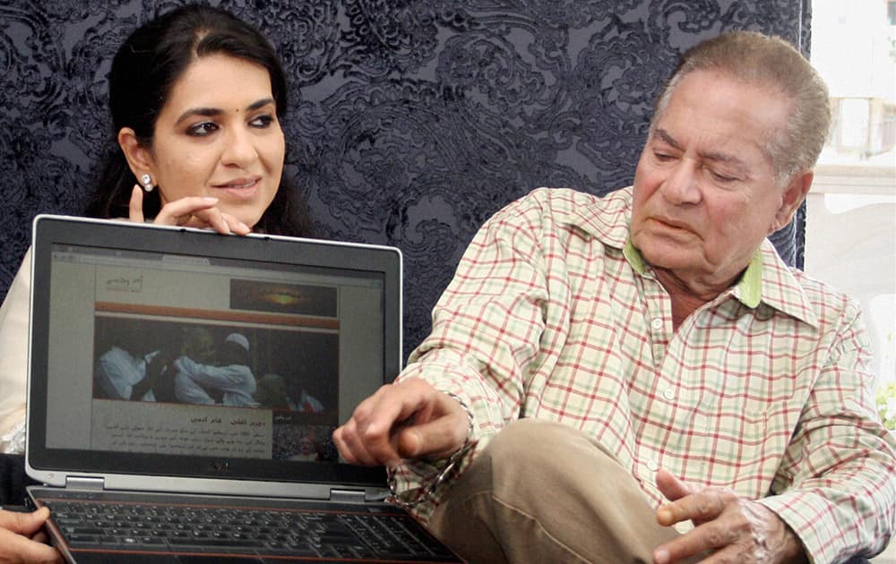 Salman Khan`s father and veteran scriptwriter Salim Khan along with BJP leader Shaina NC (L) at the launch of Urdu version of BJP prime ministerial candidate Narendra Modi`s official website in Mumbai.