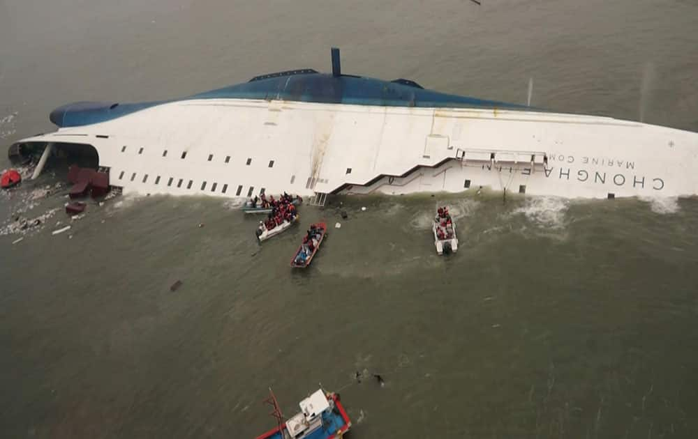 South Korean rescue team boats and fishing boats try to rescue passengers of a ferry sinking off South Korea`s southern coast, in the water off the southern coast near Jindo, south of Seoul.