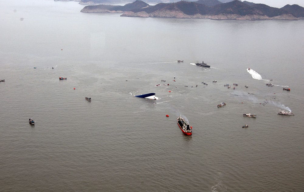 South Korean rescue team boats and fishing boats try to rescue passengers of a ferry sinking off South Korea`s southern coast, in the water off the southern coast near Jindo, south of Seoul.