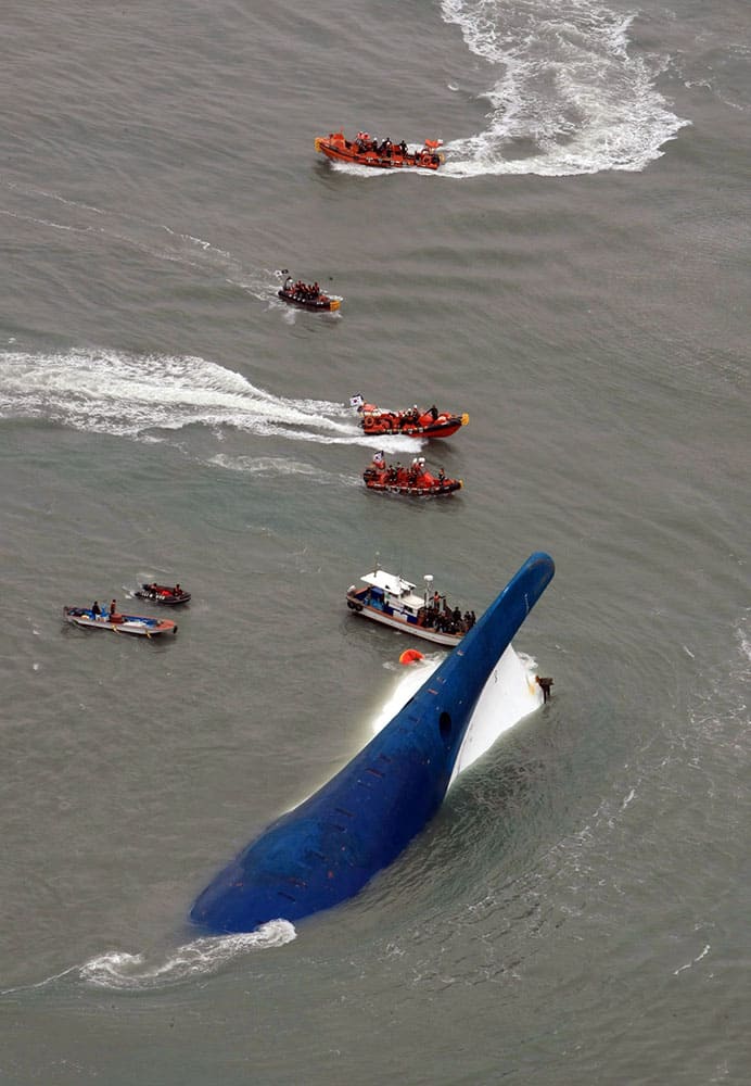 South Korean rescue team boats and fishing boats try to rescue passengers of a ferry sinking off South Korea`s southern coast, in the water off the southern coast near Jindo, south of Seoul.