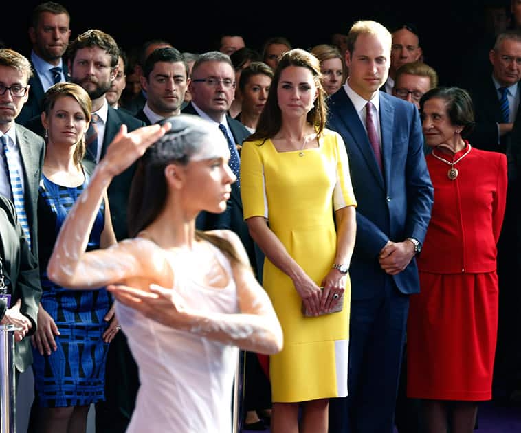 Britain`s Prince William, second from right at front, and his wife Kate, the Duchess of Cambridge, center, watch an Aboriginal welcome performance during a reception at the Sydney Opera House.