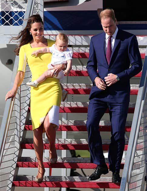 Britain`s Prince William with his wife Kate, Duchess of Cambridge, and Prince George, arrives in Sydney.