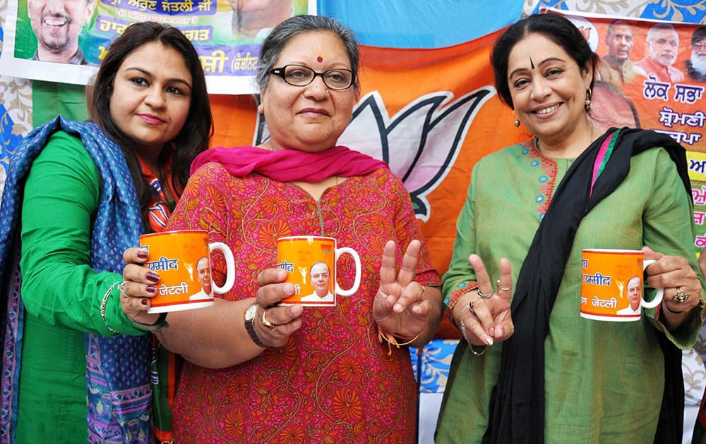 Bollywood actor BJP`s Chandigarh candidate Kirron Kher and Sangeeta Jaitley, wife of party`s Amritsar candidate Arun Jaitley, at an election campaign in favour of Arun Jaitley in Amritsar.