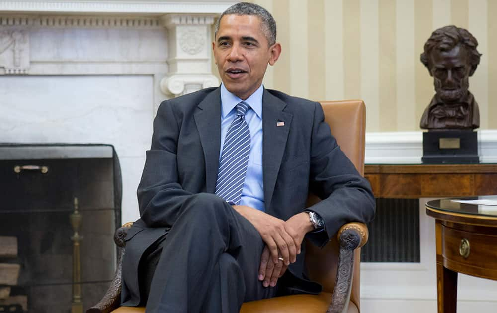 President Barack Obama meets with faith leaders in the Oval Office of the White House in Washington.