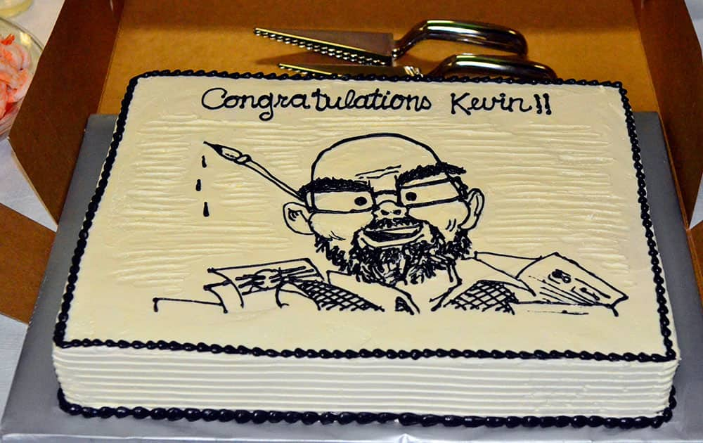 A cake is presented in honor of Charlotte Observer editorial cartoonist Kevin Siers after it was announced that Siers had been awarded the Pulitzer Award for Editorial Cartooning in Charlotte, N.C. 