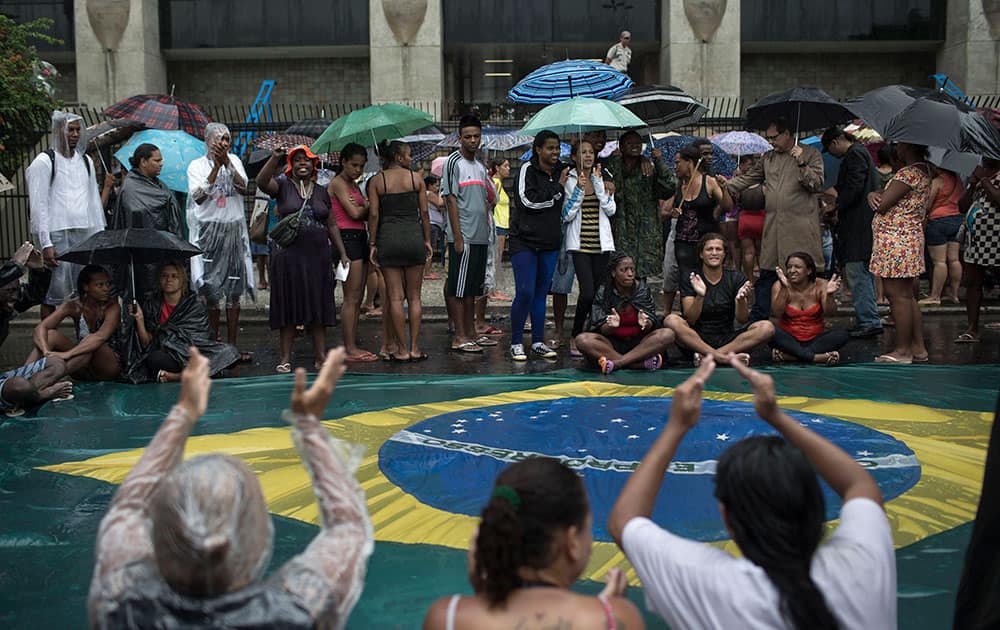 People protest outside the mayor`s office in Rio de Janeiro, Brazil.