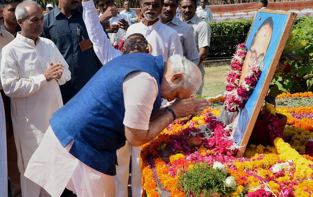 Gujarat Chief Minister and BJP Prime Ministerial candidate Narendra Modi pays tribute to Babasaheb Ambedkar at Gujarat assembly house in Gandhinagar.
