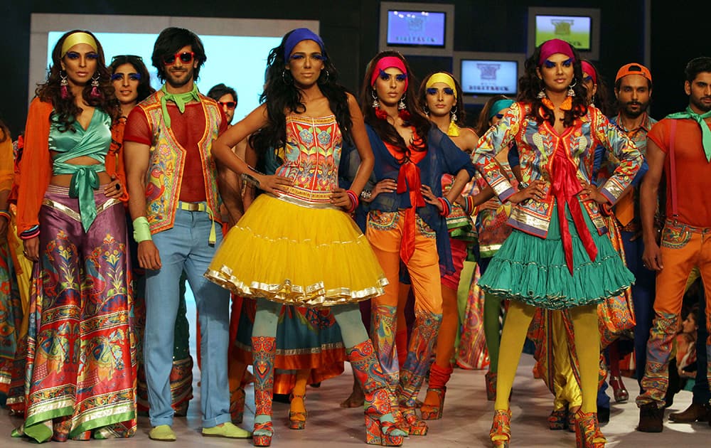 Models display creations by designer Rizwan Beyg at a fashion show organized by the Pakistan Fashion Designers Council in Lahore, Pakistan.