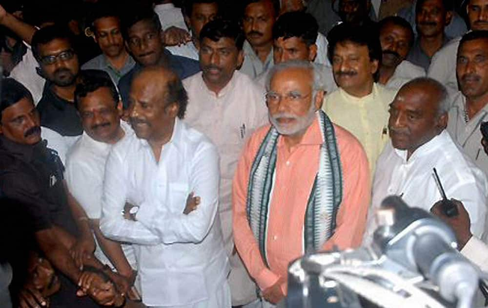 BJP Prime Ministerial candidate Narendra Modi with superstar Rajinikanth at his residence in Chennai.