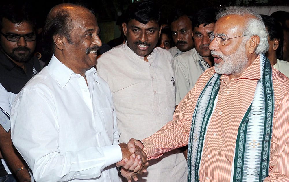 BJP Prime Ministerial candidate Narendra Modi with superstar Rajinikanth at his residence in Chennai.