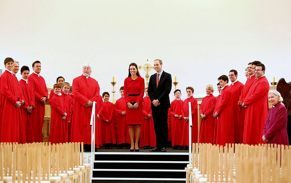 Britain`s Prince William, center right, and his wife Kate, the Duchess of Cambridge, center left, pose with members of the Christchurch Cathedral choir during visit to the Transitional Cathedral in Christchurch, New Zealand.