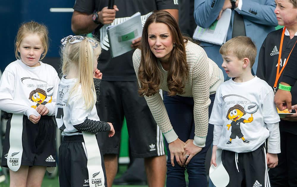 Britain`s Kate, the Duchess of Cambridge, speaks with Pirates team members as she and her husband Prince William visit a young players’ rugby tournament, at Forsyth Barr Stadium, in Dunedin, New Zealand.