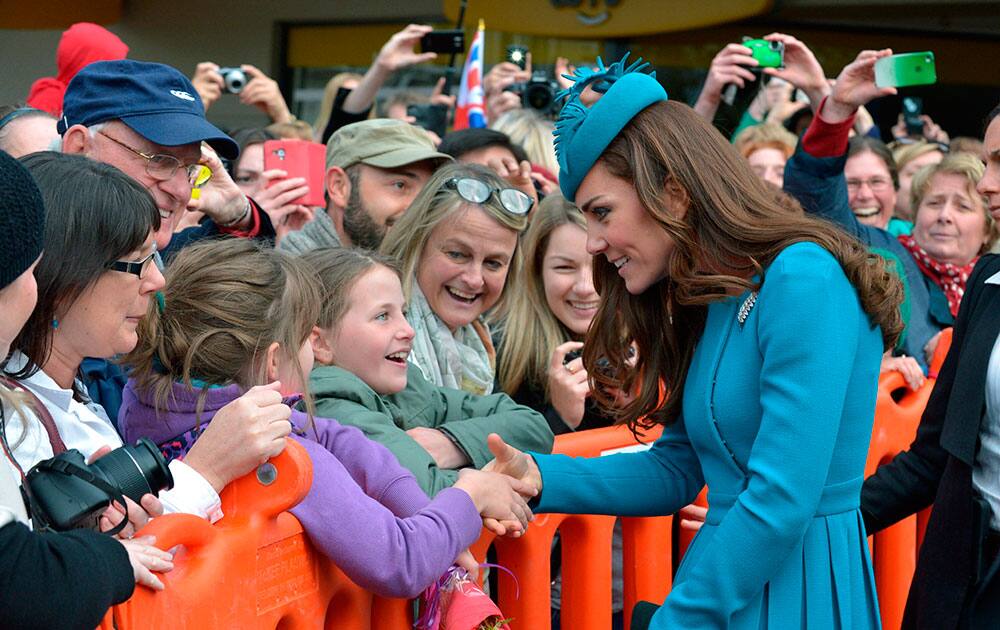 Britain`s Kate, the Duchess of Cambridge, meets with people after a Palm Sunday service at the Cathedral in Dunedin, New Zealand.