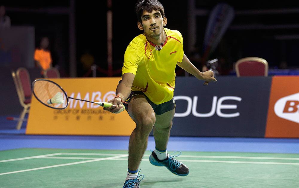 K. Srikanth of India returns a shot to Lee Chong Wei of Malaysia during their semifinal match at the Singapore Open Badminton championship in Singapore.