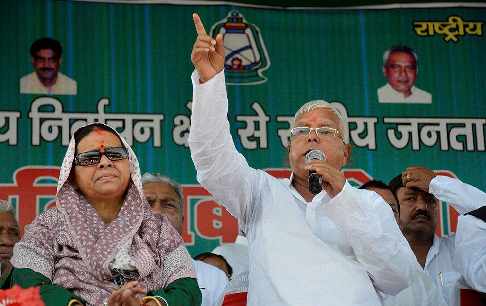 RJD chief Lalu Prasad along with his wife and party Lok Sabha candidate from Saran Rabri Devi addresses an election campaign rally in Chapra.