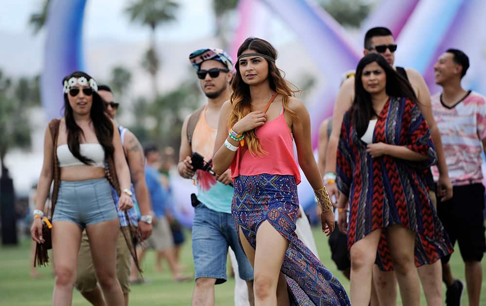 Coachella festivalgoers arrive at Empire Polo Field on day one of the 2014 Coachella Music and Arts Festival, in Indio, Calif.