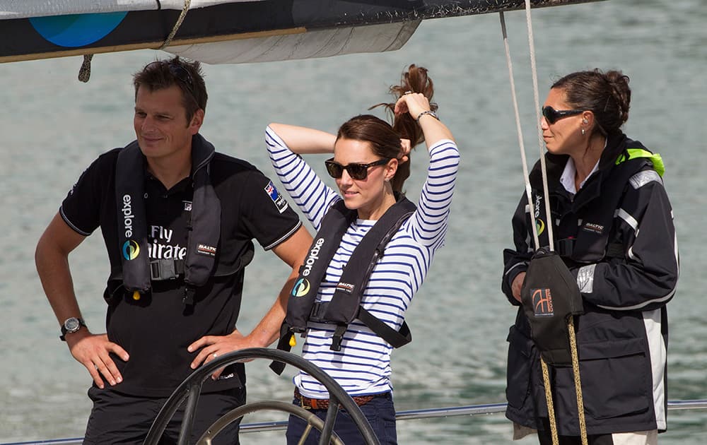 Britain`s Kate, the Duchess of Cambridge stands with Team New Zealand Skipper Dean Barker prepare to go match-race sailing on Americas Cup yachts, Auckland, New Zealand.