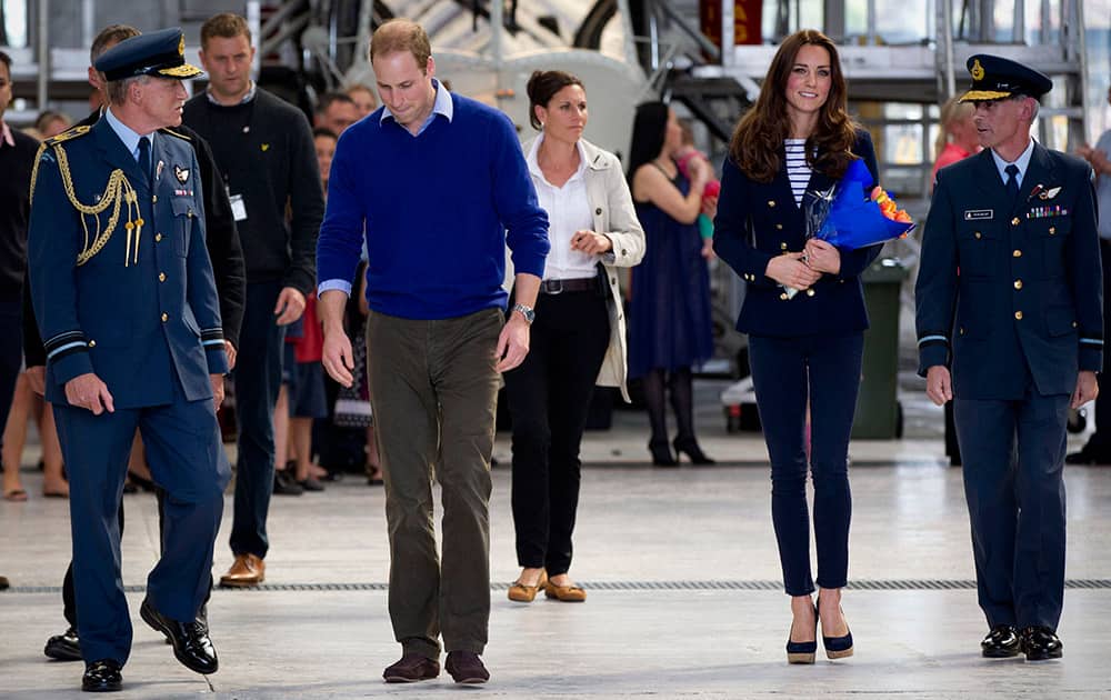 Britain`s Prince William, and his wife, Kate, the Duchess of Cambridge, arrive to meet with families at the Royal New Zealand Air Force base Whenuapai in Auckland.