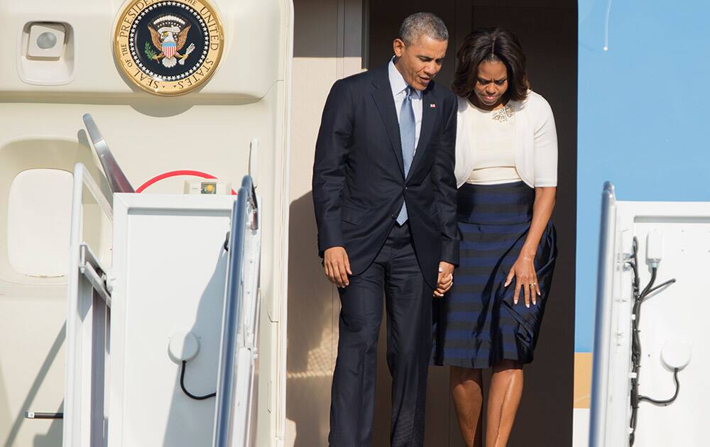 President Barack Obama and first lady Michelle Obama disembark from Air Force One as they arrive Andrews Air Force Base, Md.