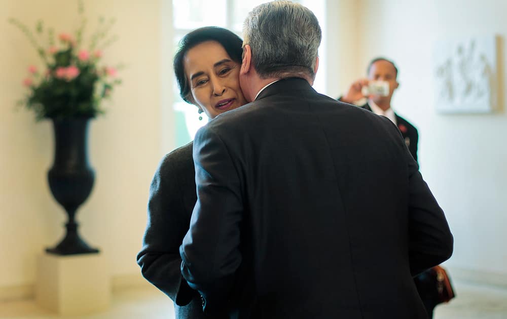 German President Joachim Gauck hugs Myanmar Opposition Leader Aung San Suu Kyi as she arrives for a meeting at his residence, the Bellevue Palace in Berlin, Germany.