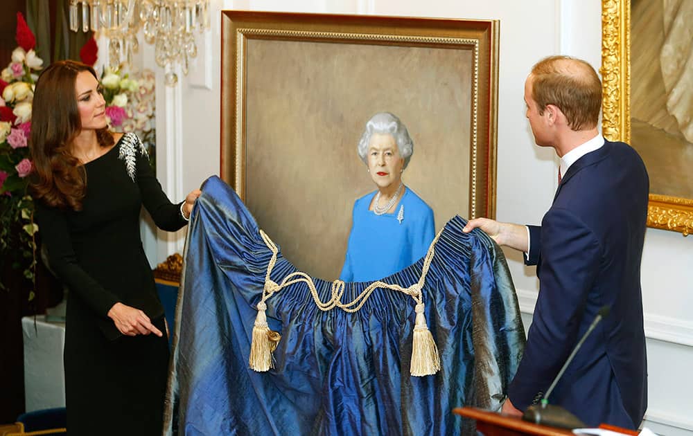 Britain`s Prince William, right, and Kate, the Duchess of Cambridge, unveil a portrait of Queen Elizabeth II, by New Zealand artist Nick Cuthell, during a state reception at Government House in Wellington, New Zealand.