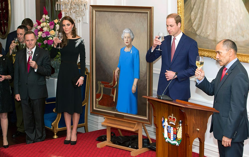Britain`s Prince William, second right, and his wife Kate, Duchess of Cambridge, along with New Zealand Prime Minister John Key, left, and Governor-General, Sir Jerry Mateparae, right, toast after the unveiling of a portrait of Queen Elizabeth II during a State reception at Government House in Wellington, New Zealand.