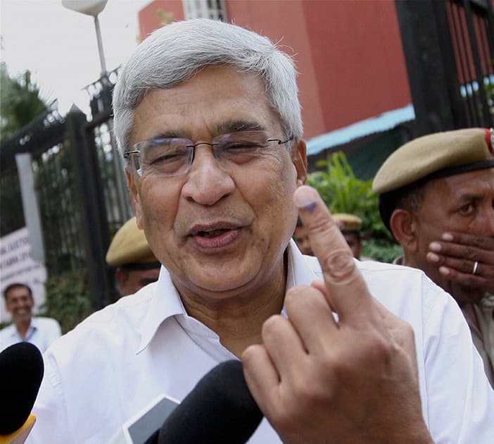 CPI-M General Secretary Prakash Karat shows the indelible ink on his finger after casting his votes for the Lok Sabha elections in New Delhi.