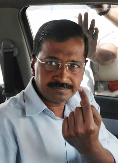 AAP convener Arvind Kejriwal leaves after casting his vote at a polling station at Tilak Marg in New Delhi during voting for the third phase of the Lok Sabha elections.