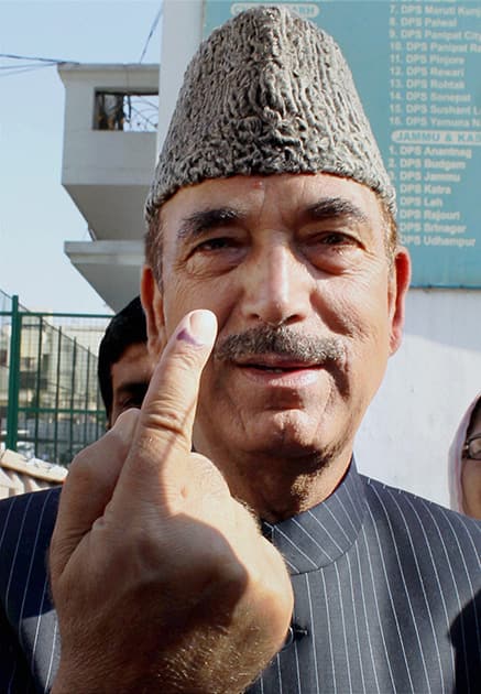 Union Health Minister and Congress candidate from Udhampur Ghulam Nabi Azad shows his ink-marked finger after casting his vote.