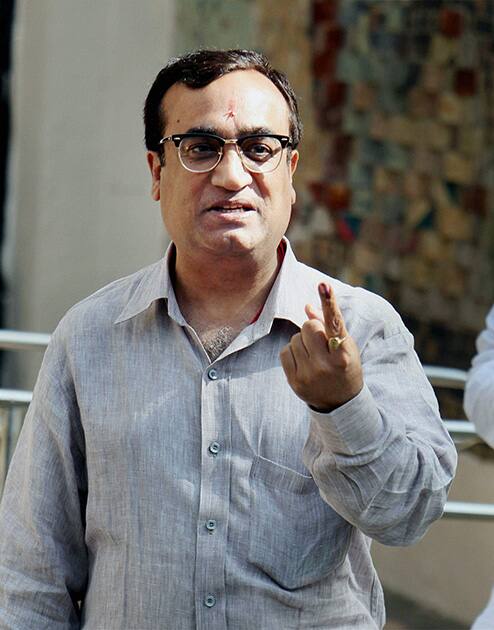 Congress candidate Ajay Maken shows his ink-marked finger after casting his vote at Nirman Bhawan polling station in New Delhi during the voting for the third phase of the Lok Sabha elections.