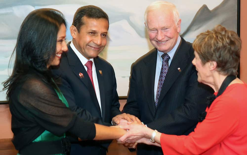 President of Peru Ollanta Humala Tasso and his wife Nadine Heredia, left, have a group hand shake with Governor General of Canada David Jonston and his wife Sharon, right, before a state dinner hosted by Canadian Governor General David Johnston at Rideau Halll in Ottawa, Ontario.