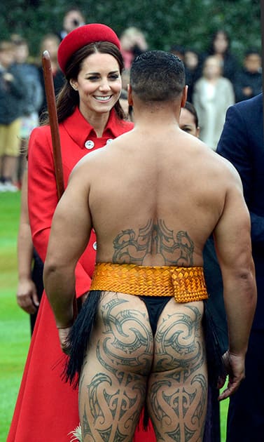 Britain`s Kate, the Duchess of Cambridge, chats with a Maori warrior at the official welcome for her and her husband Prince William, at Government House, in Wellington, New Zealand.