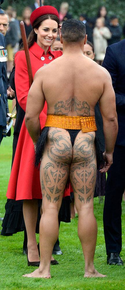 Britain`s Kate, the Duchess of Cambridge, chats with a Maori warrior at the official welcome for her and her husband Prince William, at Government House, in Wellington, New Zealand.