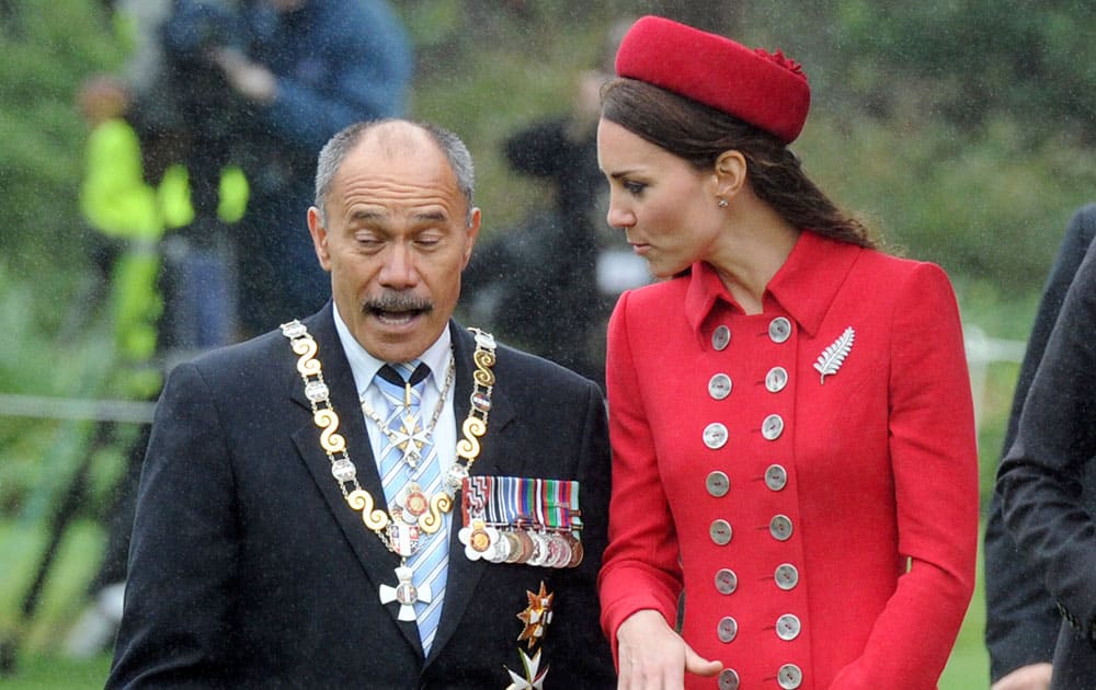 Britain`s Catherine, Duchess of Cambridge, right, walks with the Governor General of New Zealand Sir Jerry Mateparae, at the official welcome at Government House, in Wellington, New Zealand.
