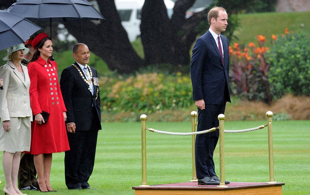 Britain`s Prince William takes a Royal Salute watched by Catherine, Duchess of Cambridge, and the Governor General of New Zealand Sir Jerry Mateparae, at the official welcome at Government House, in Wellington, New Zealand.