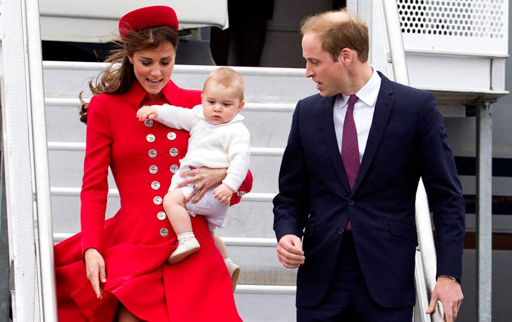 Britain`s Prince William and Catherine, Duchess of Cambridge with Prince George arrive for their visit to New Zealand at the International Airport, in Wellington, New Zealand.