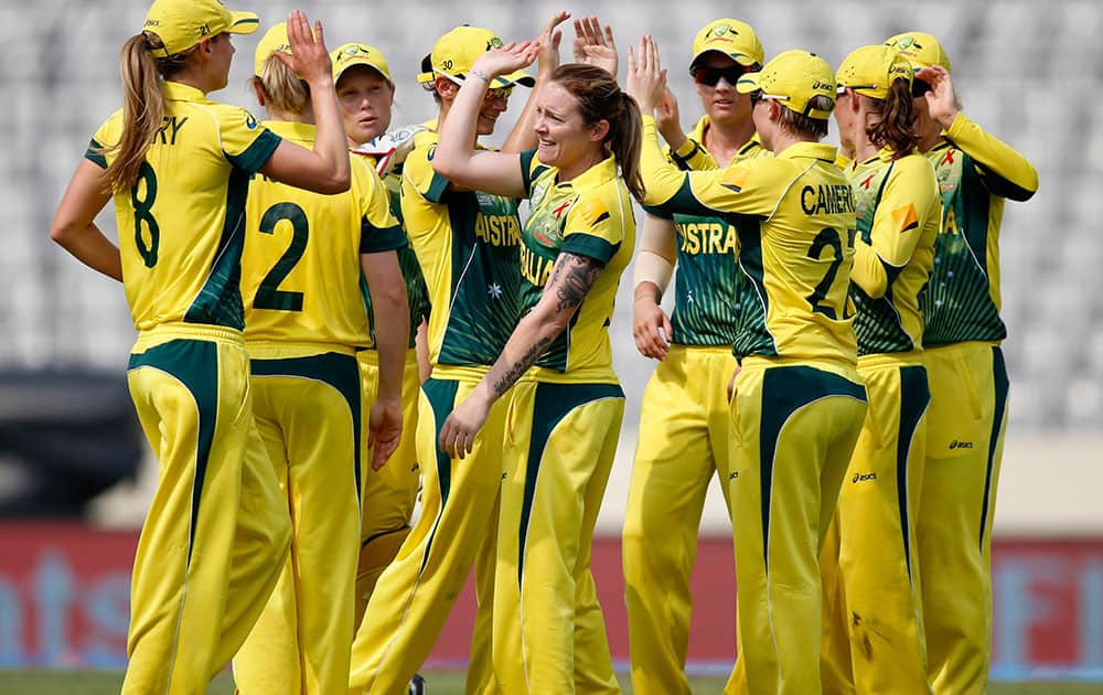 Australia`s bowler Sarah Coyte, center without cap, celebrates with teammates the dismissal of England`s captain Charlotte Edwards during their ICC Women`s Twenty20 Cricket World Cup final match in Dhaka.